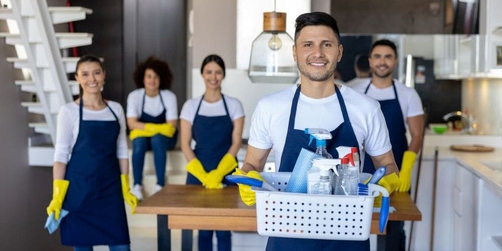 Cleaning crew ready to start cleaning a house.